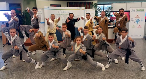 Wang Deqing (in black) and his students display their skills at the United Nations office in Vienna. (Provided to China Daily)